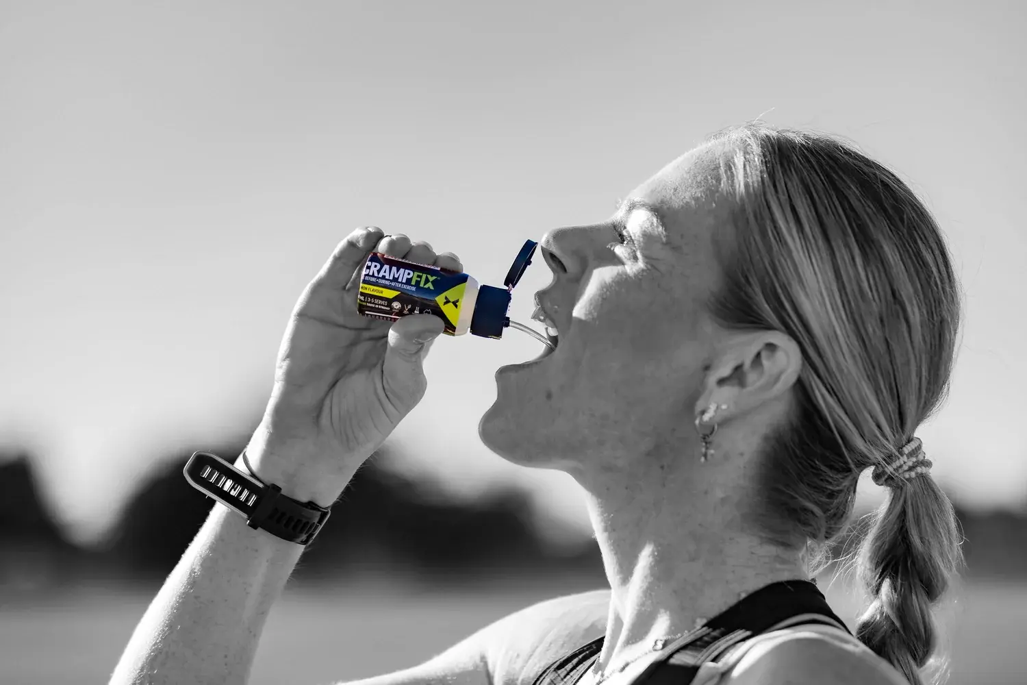 Female Athlete drinking Crampfix